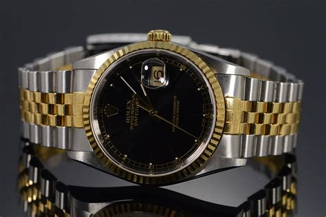 rolex oyster perpetual datejust gold black face